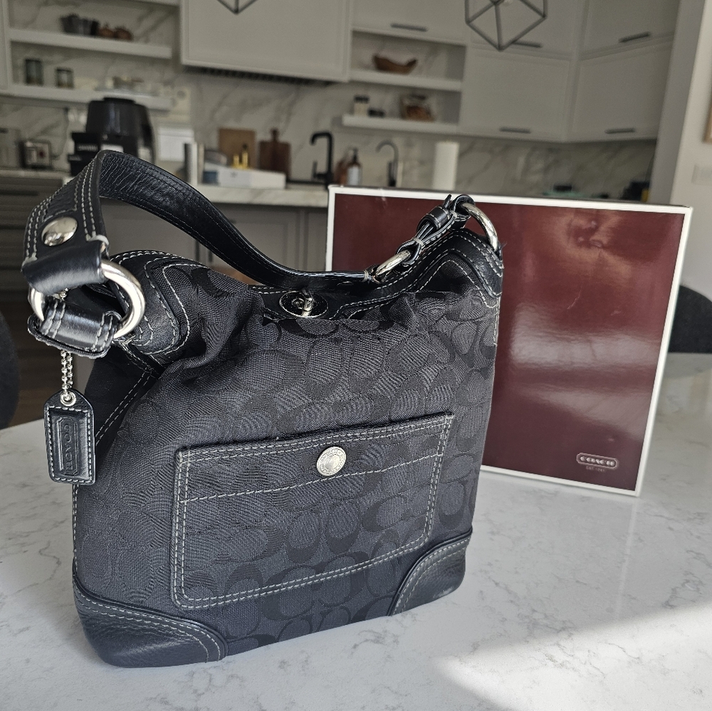 Black on black signature Coach shoulder bag purse